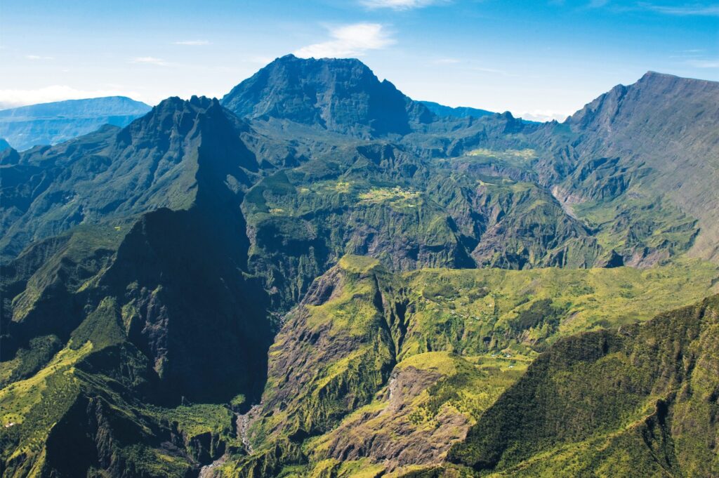 Lush green mountain ranges and cirques seen from above